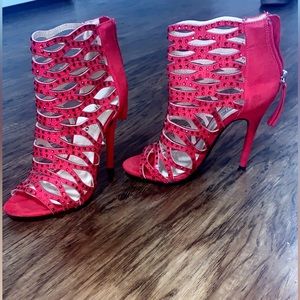 Size 7 red heels barely worn. Open toe and zip up back. In great condition